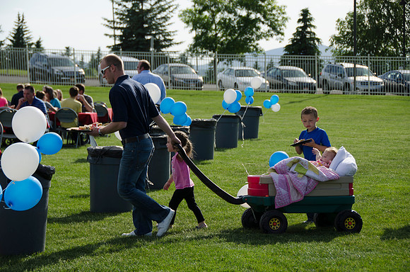Online instructors gather with their families for an eveing of BBQ and games.