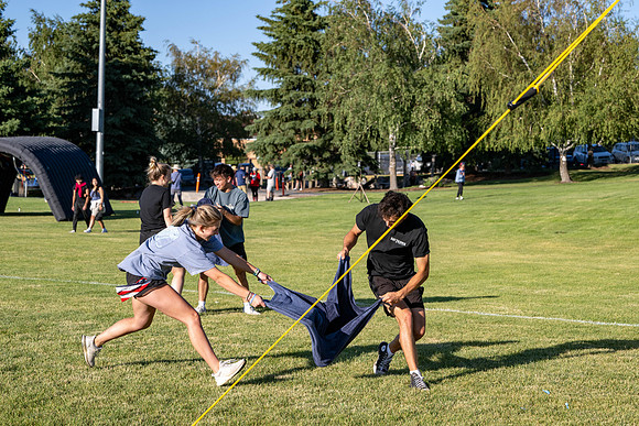Students gather at the upper field for various 4th of July activities.