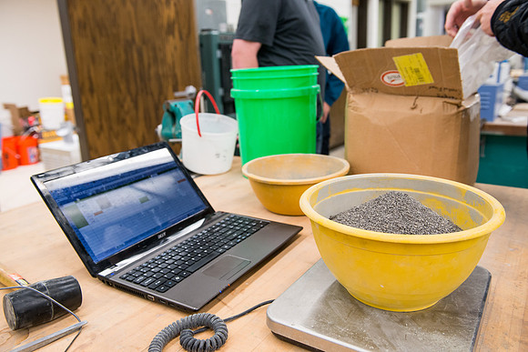 Civil engineering students work with different mixtures of cement to make a light, yet durable, cement that will be the building material for a canoe.