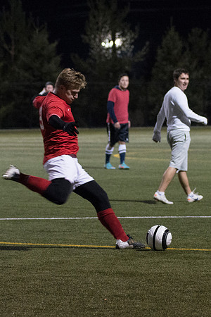 Co-Ed Intermediate Soccer teams play game.