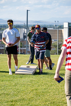 Students gather at the upper field for various 4th of July activities.
