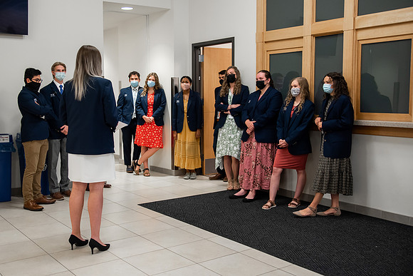 Ushers perform their duties in the I-Center to prepare for devotional. Used for an usher training video.