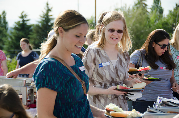 Online instructors gather with their families for an eveing of BBQ and games.