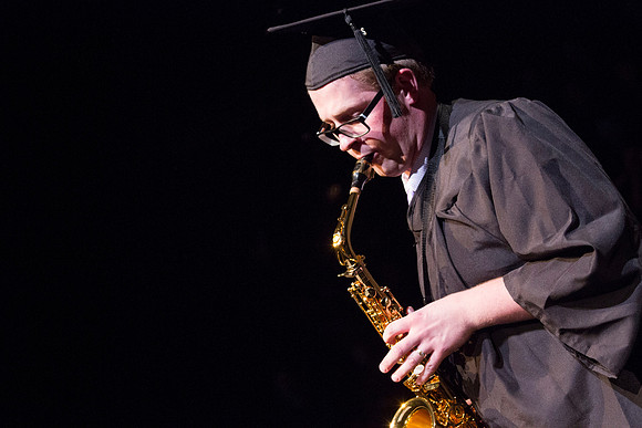 Kent Grover, Bachelor of Music, Jazz Studies, peforms a solo during convocation during the Spring Semester Graduation in the Snow Building.