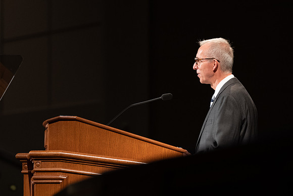 Vice President Kelly Burgener introduces the devotional speaker.