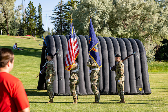 Students gather at the upper field for various 4th of July activities.