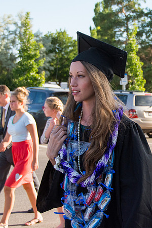 Faculty, family and graduates around campus after the commencement ceremony.
