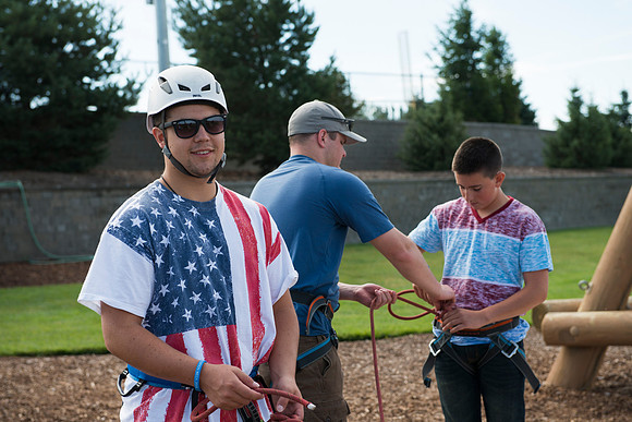 Youth high enjoy the Ropes Course class.