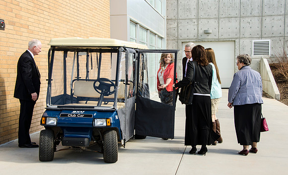 President Clark accompanies the devotional speaker and his guests in the tour cart to the BYU-Idaho Center. The cart is also used to give tours of campus.