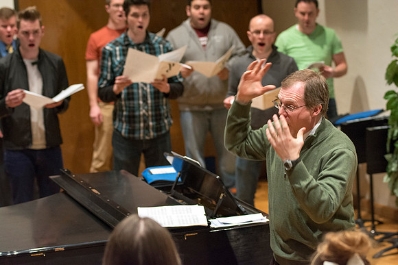 Randall Kempton instructs the talented students who make up the Collegiate Singers at BYU-Idaho.