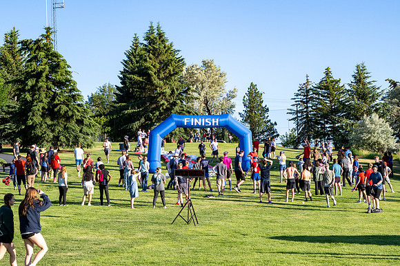 Students gather at the upper field for various 4th of July activities.
