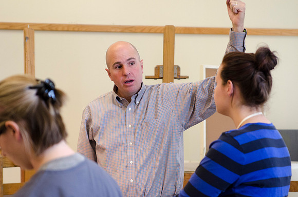 David Belka enthusiatically teaches painting principles to beginning painting class.