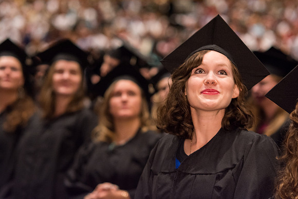 BYU-Idaho graduates walk in to the commencement ceremony, held in the BYU-Idaho Center. Photo by Ryan Chase