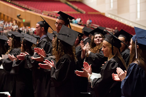 The 2014 Winter Semester graduates give a round of applause to those who helped make this night possible.