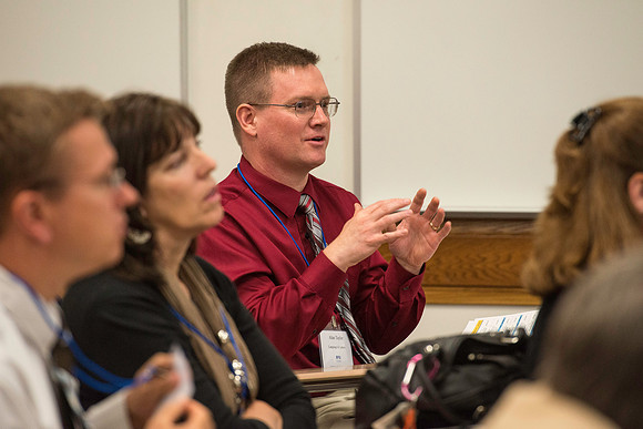 Faculty gather in the Hinckley Building for a conference to learn from their peers.