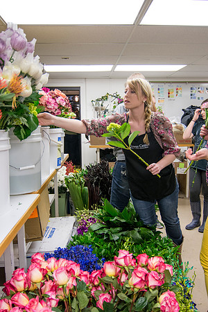 Horticulture students prepare for a semester review fashion show that will show their floral designs as well. Brother Romney leads the students along with other instructors.