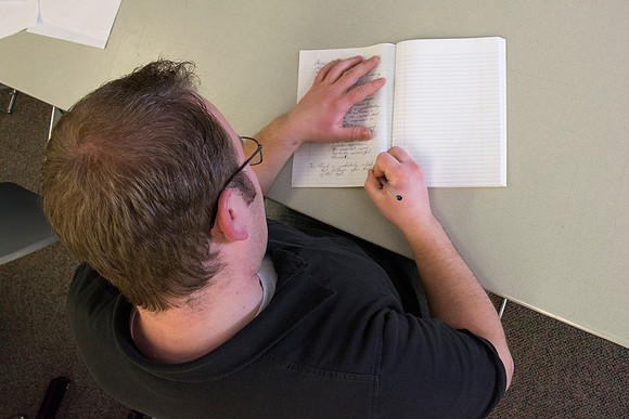 Students participate in the Writing Workshop to receive critiques on their work.