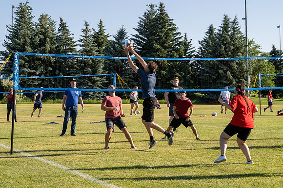 Students gather at the upper field for various 4th of July activities.