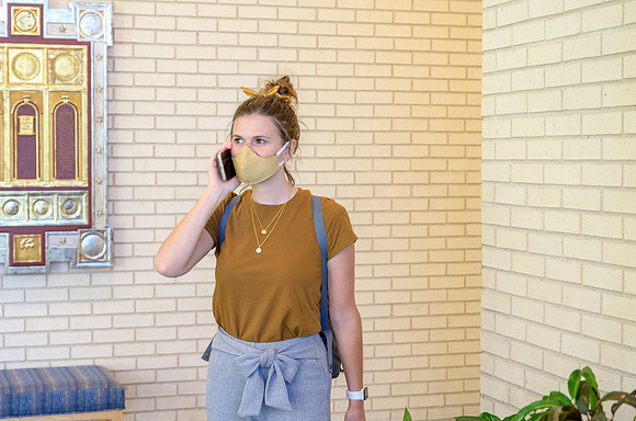 Student volunteers show the way to stay safe during this COVID 19 pandemic by social distancing, following pathway arrows and proper wearing of masks .