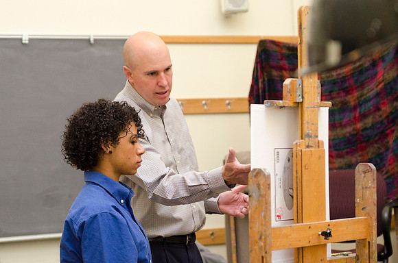 David Belka enthusiatically teaches painting principles to beginning painting class.