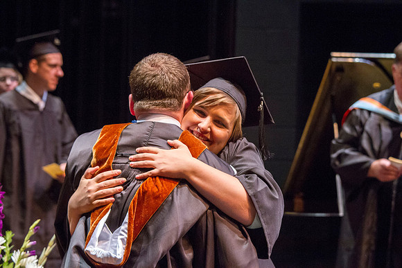 Dean's of the College of Performing and Visual Arts award diplomas to graduates during convocation held in the Snow Building. Photo by Tyler Rickenbach