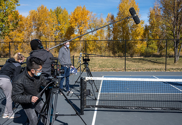 Dinking around playing pickleball for the HR Wellness Video.