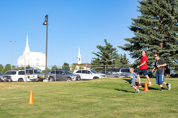 Students gather at the upper field for various 4th of July activities.