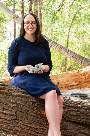 Rachel Tullis, an interdisciplinary science major, studying geology and biology. Rachel with some of her favorite rocks with fossils. Photo for LDS Philanthropies.