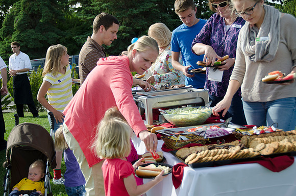 Online instructors gather with their families for an eveing of BBQ and games.