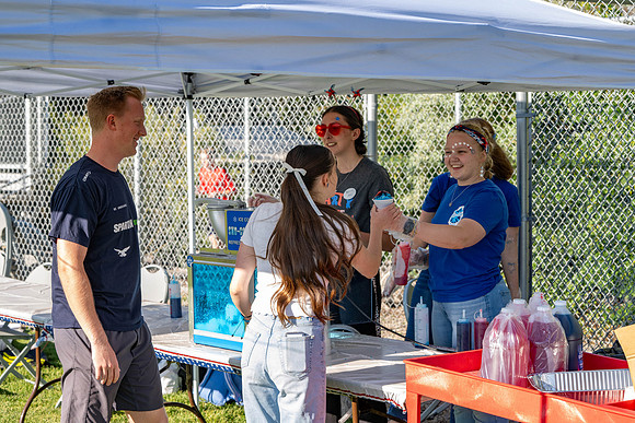 Students gather at the upper field for various 4th of July activities.