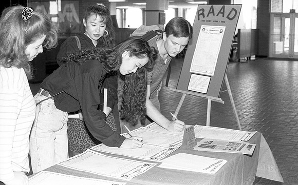 Students sign to commit to stay Drug-free. April 1990.