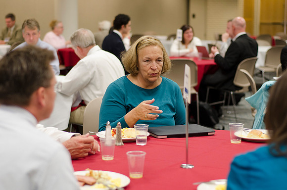 Online instructors gather for breakfast and instruction.