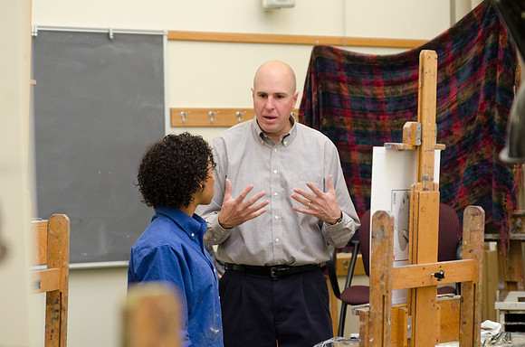 David Belka enthusiatically teaches painting principles to beginning painting class.