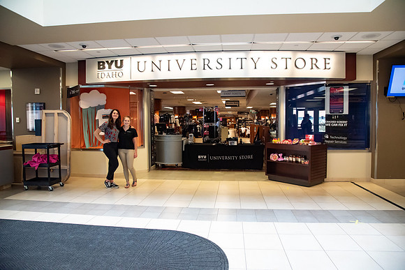 Student employees working at the pick up desk at the University Store since the store is closed to people walking through during the Covid-19 Pandemic.
