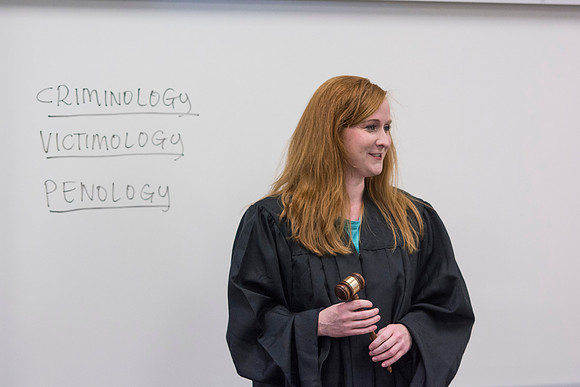 Sister Jenson eagerly talks to her Criminology class at 7:45 a.m. on a rainy Friday morning during the 2014 Spring Semester.
