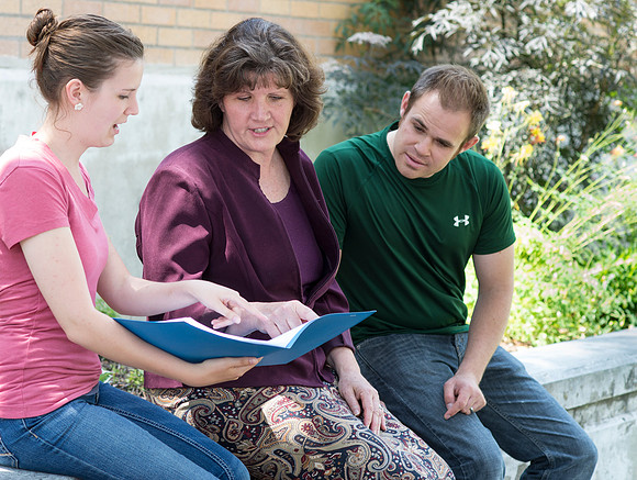 Sister Brooke McKenna teaches students in a communication class.