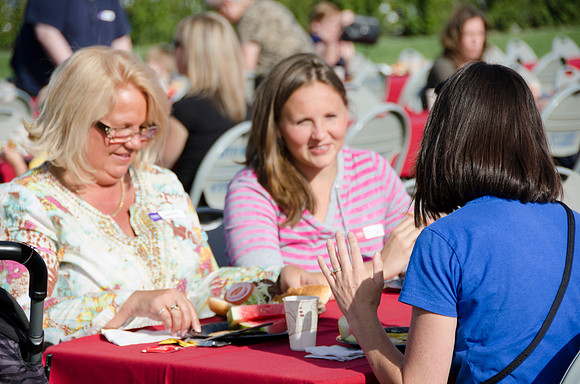 Online instructors gather with their families for an eveing of BBQ and games.