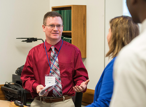 Faculty gather in the Hinckley Building for a conference to learn from their peers.