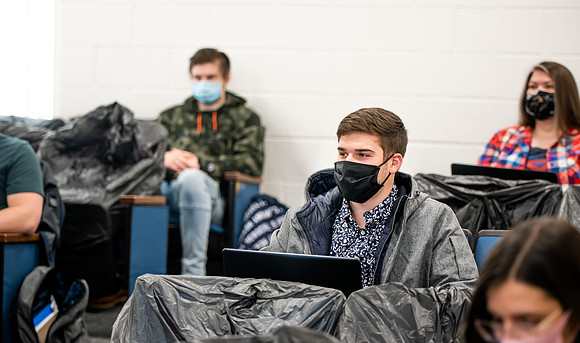 BYUI classes in the religion department meeting during Covid-19 with masks and social distanced seating.