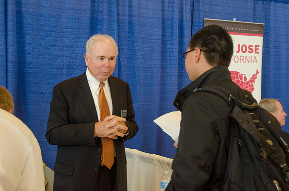 BYU-Idaho students speak to representatives from colleges or companies from their field of study at a career fair held in the I-Center gym