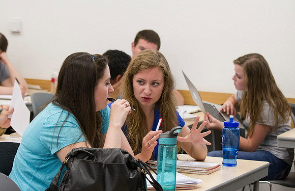 Students in Brother Yost's World Civilization to AD class talk amongst themselves in groups.