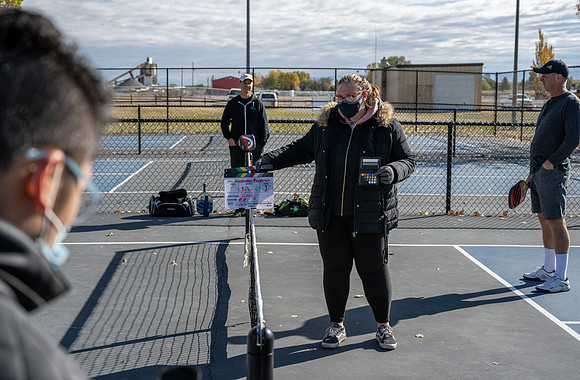 Dinking around playing pickleball for the HR Wellness Video.