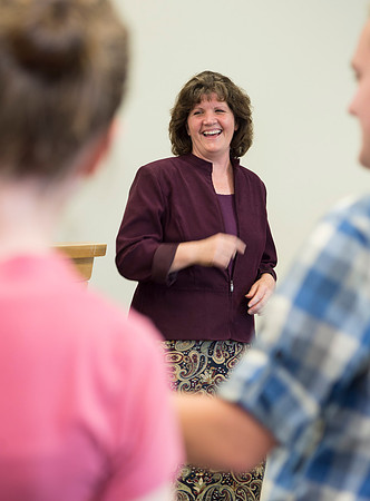 Sister Brooke McKenna teaches students in a communication class.