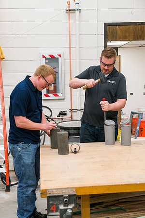 Civil engineering students work with different mixtures of cement to make a light, yet durable, cement that will be the building material for a canoe.