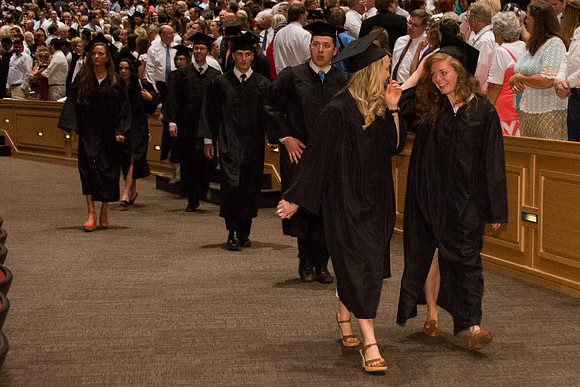 BYU-Idaho graduates walk in to the commencement ceremony, held in the BYU-Idaho Center.