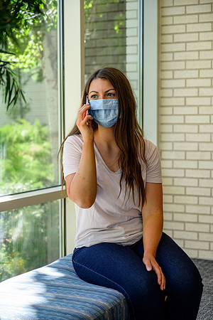 Student volunteers show the way to stay safe during this COVID 19 pandemic by social distancing, following pathway arrows and proper wearing of masks .