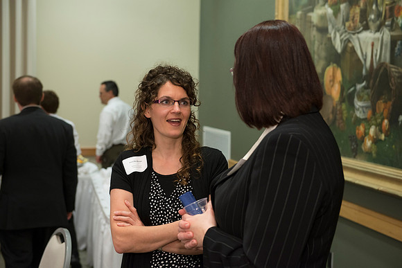 Online Leaning Graduates gather in the MC Special Events room for a reception.
