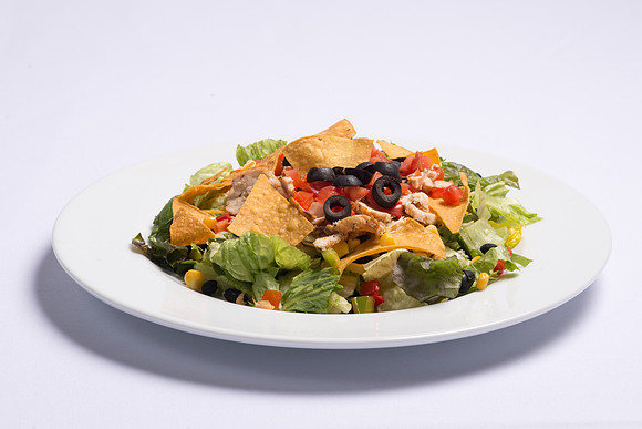 BYU-Idaho Food Service Catering. Southwest Salad Fresh mixed Salad Greens, topped with marinated sliced Chicken Breast, chopped Vegetables, Tomatoes, shredded Cheddar Cheese and Tortilla Chips. Served