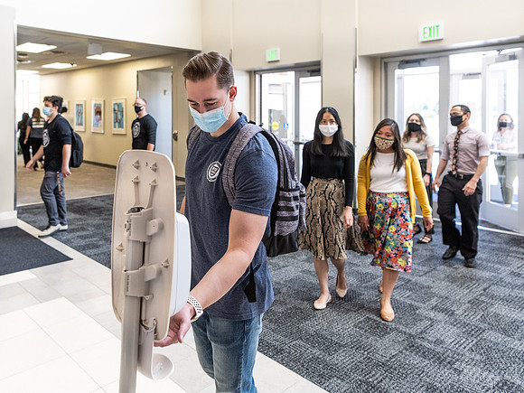 Students use hand sanitizer on campus to stay safe and healthy.