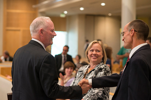 President Kim B. Clark shakes hand with Doug Stutz after a devotional in the Taylor Chapel.